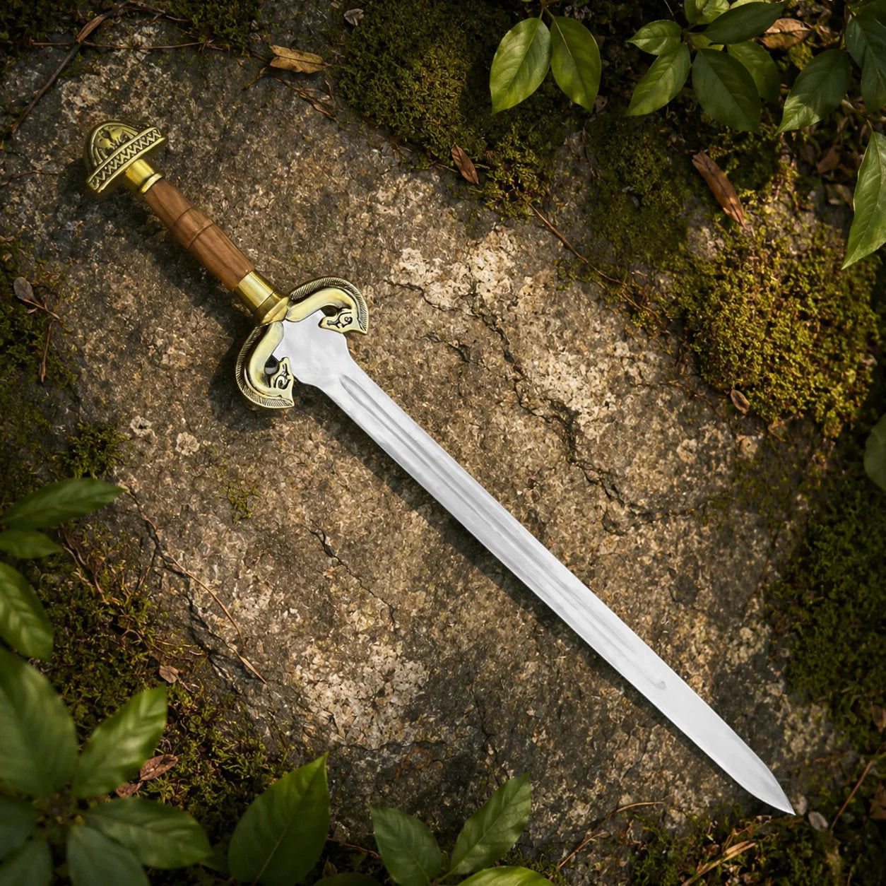 Éowyn sword prop replica full length on mossy stone in sunlit forest showing complete polished silver blade ornate antique brass crossguard domed pommel and brown leather grip – LOTR Shieldmaiden collectible