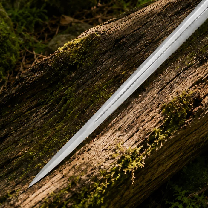 Glamdring sword of Gandalf prop replica full length on mossy rock with black leather scabbard and leather straps showing complete display set with ornate crossguard and bullet pommel – LOTR fan gift
