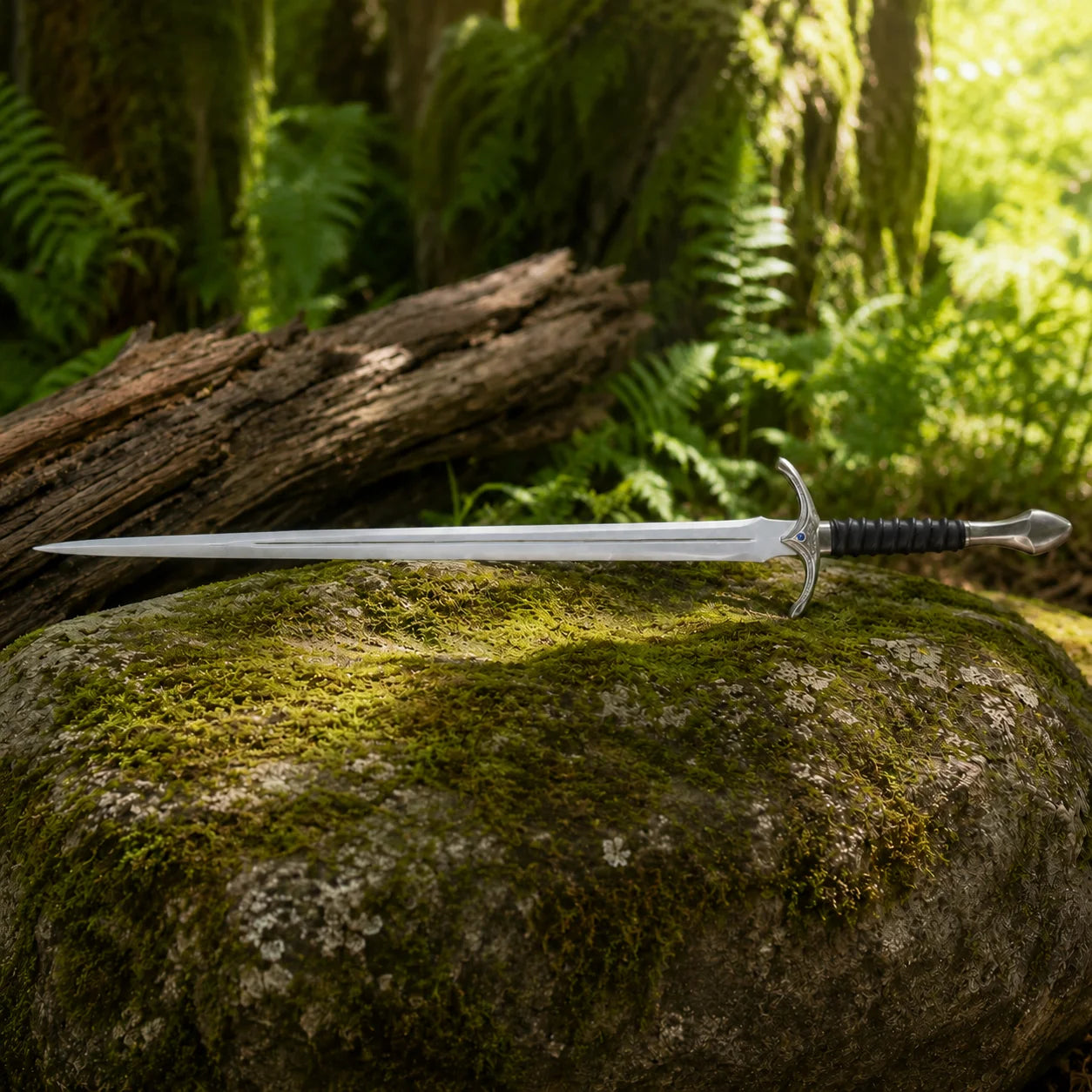 Glamdring sword of Gandalf prop replica full length on mossy forest rock in golden bokeh showing ornate engraved crossguard black leather ribbed grip and long polished double fuller blade – LOTR collectible