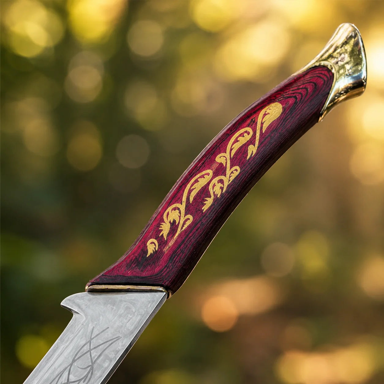 Hadhafang Arwen Elven sword prop replica full length with black leather scabbard on mossy forest rock in sunlit forest – LOTR display collectible