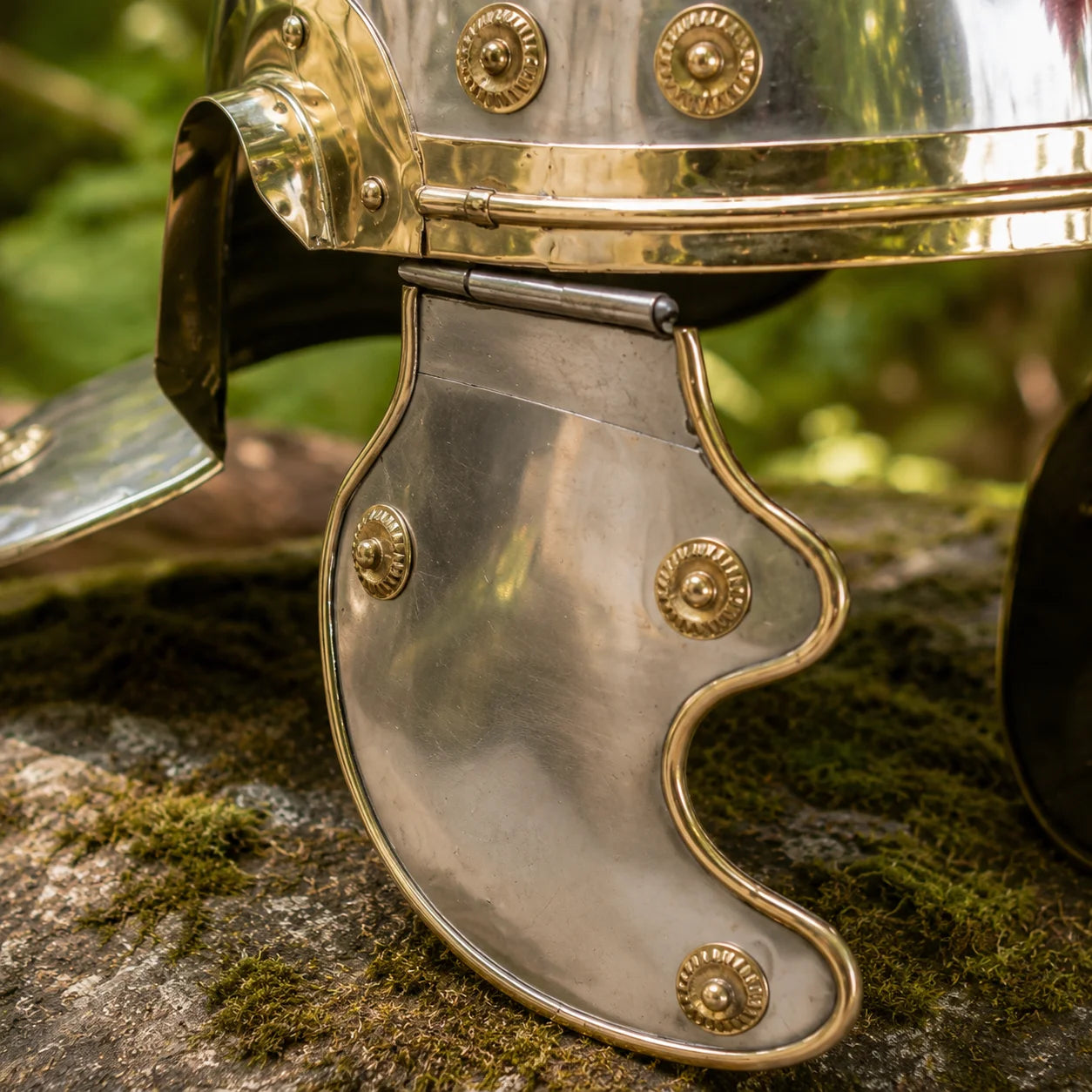 Roman Centurion helmet prop replica – close-up of polished steel dome with gold wave accent detail