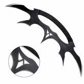 Star Trek Klingon Bat'leth collectible prop replica displayed on mossy rock in forest setting