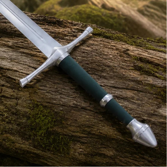 Aragorn Strider ranger sword prop replica green edition with dark green scabbard and companion dagger displayed on mossy rock in sunlit forest – LOTR Ranger display set collectible