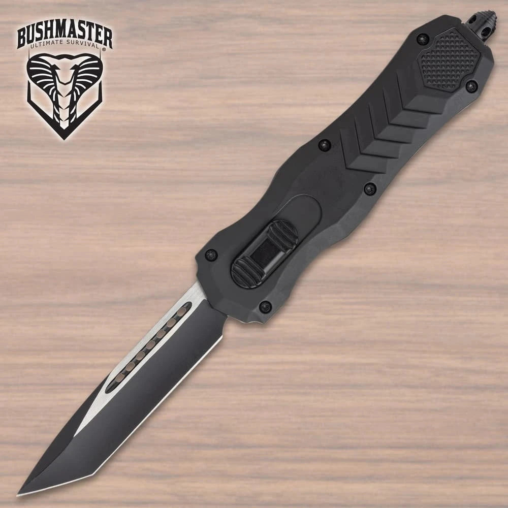 Bushmaster Diamondback OTF Knife collector display piece with black angular handle, silver-tone accent detail, textured grip panels, branded clip, and compact showcase presentation