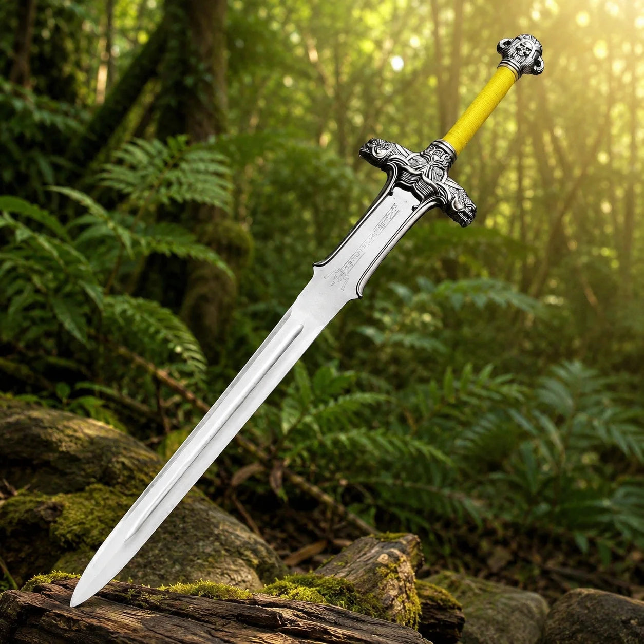 Conan Atlantean sword prop replica held in gloved hand in sunlit jungle forest showing full polished silver blade with central fuller runic engravings ornate silver dragon crossguard and bright yellow cord-wrapped grip – Conan the Barbarian cosplay prop
