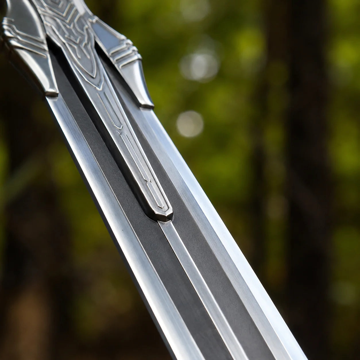 Artorias Greatsword prop replica standing upright in forest – Dark Souls display collectible