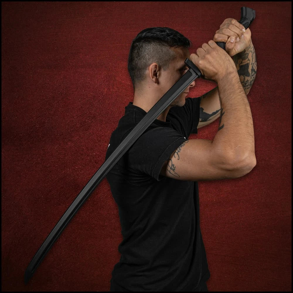 Man posing with Honshu Eastern Martial Arts black katana raised – fan-inspired samurai display set