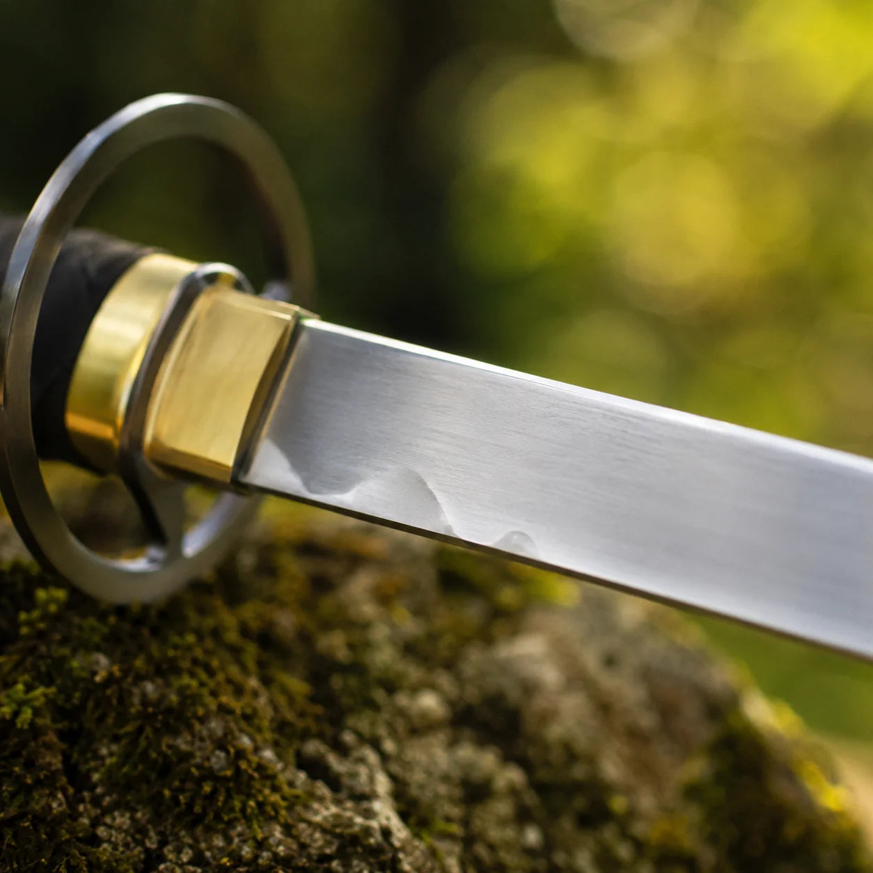 Close-up of Shinso Zanpakuto prop replica tsuba guard and brass fittings – Bleach cosplay accessory detail