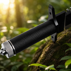 Rambo First Blood Part II Stallone Signature Edition knife prop replica on mossy rock with white display storage tube and detached knurled silver pommel cap with built-in compass showing Sylvester Stallone full name engraving 1188 10000 limited edition numbering RAMBO FIRST BLOOD PART II crossguard and complete hollow handle display kit – John Rambo Signature Edition collectible