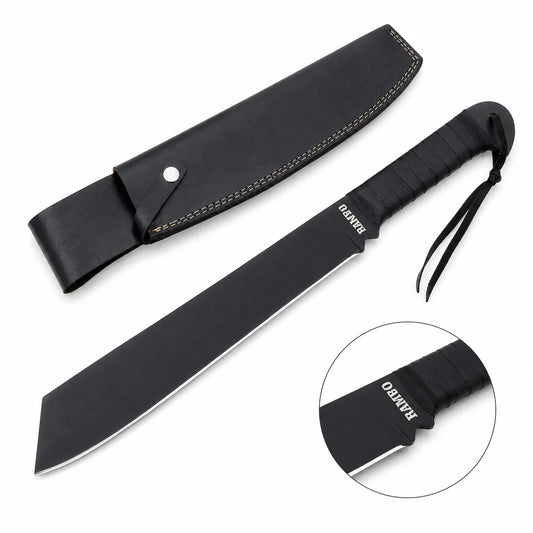 Rambo IV Machete prop replica held in gloved hand in sunlit green jungle forest showing wide black matte display finish cleaver-style blade with RAMBO engraving near ricasso and black leather-wrapped handle with finger-notch guard – John Rambo 2008 movie display collectible