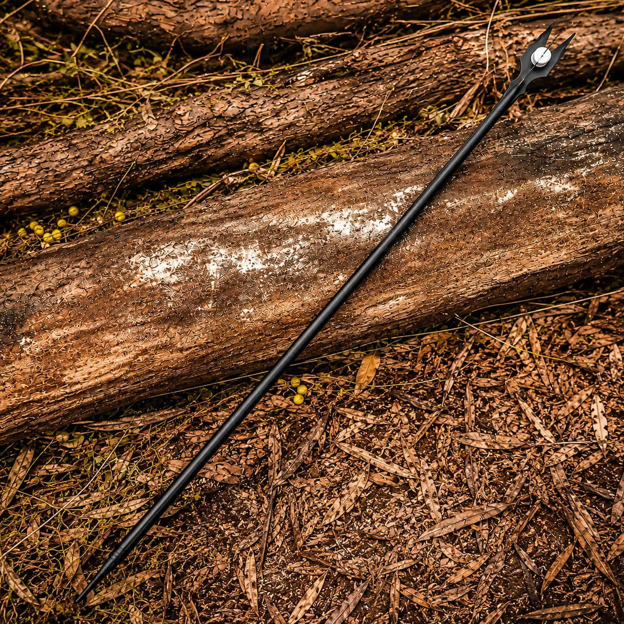 Close-up of Saruman staff forked crown with white Palantír orb on rock – LOTR prop replica