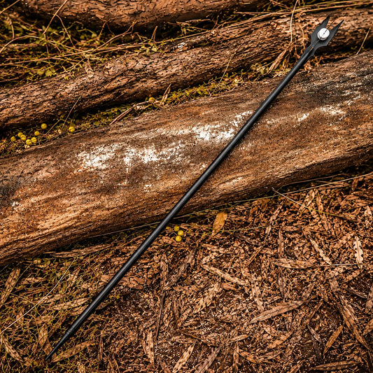 Close-up of Saruman staff forked crown with white Palantír orb on rock – LOTR prop replica