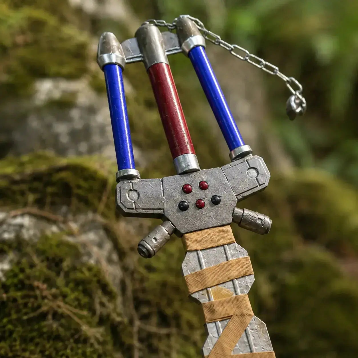 Sora Fenrir Keyblade Kingdom Hearts prop replica displayed on mossy forest rock – fan collectible gift