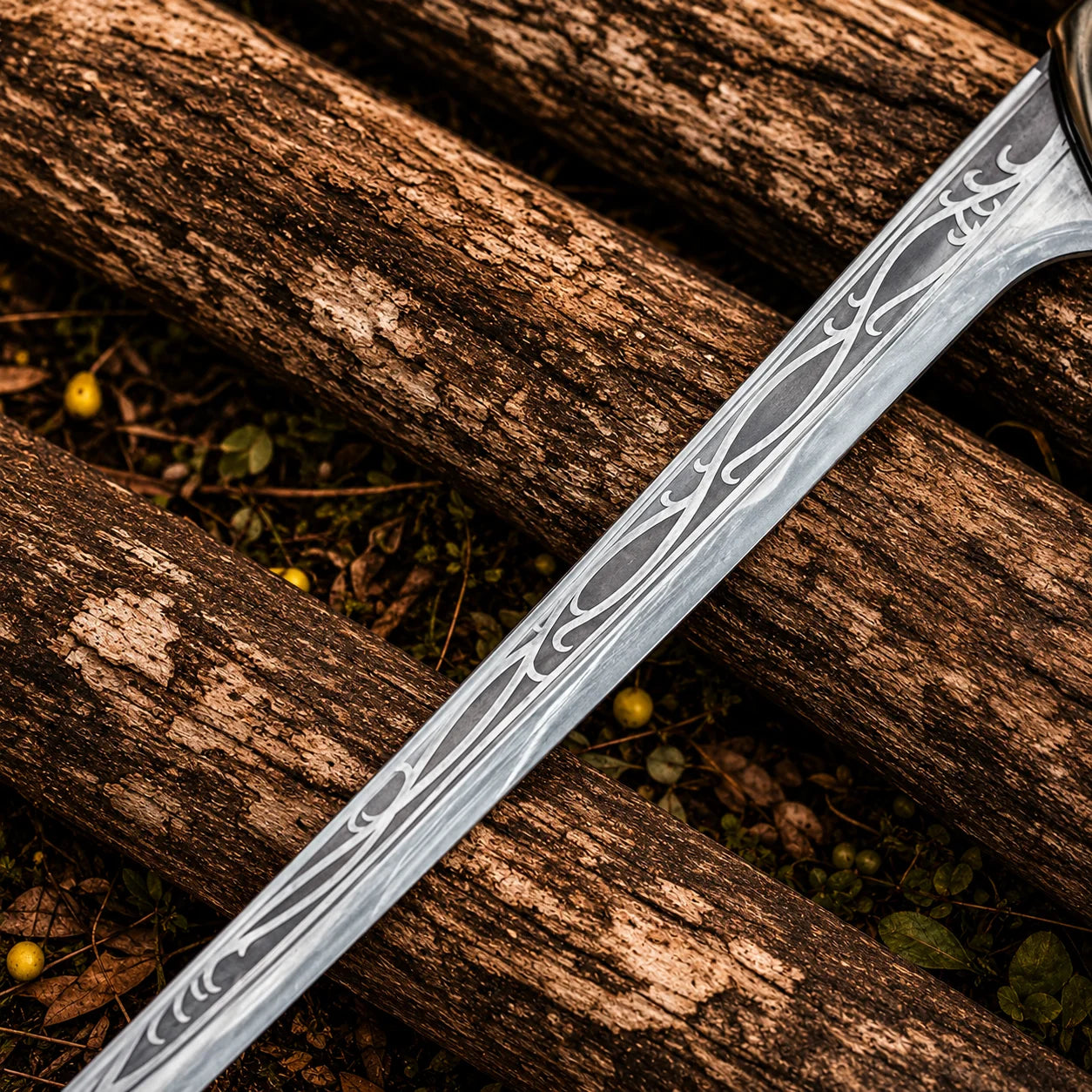 Close-up of Thranduil sword prop replica etched elven vine and scroll engravings on curved blade on forest logs – LOTR fantasy collectible