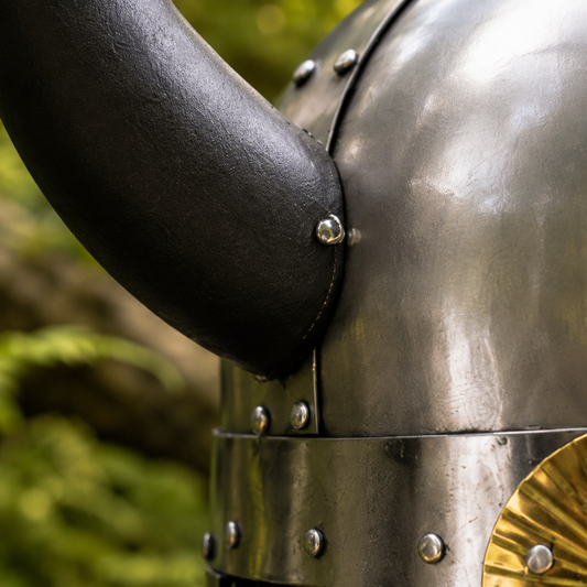 Viking Horned Saga Helmet Norse warrior prop replica displayed on forest rock – front angle collectible view