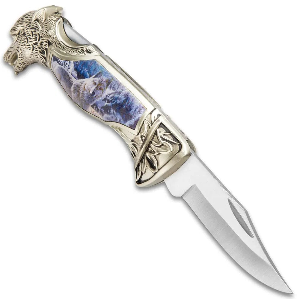 Winter wolf pocket knife with sculpted cast metal handle and winter scene artwork for collection
