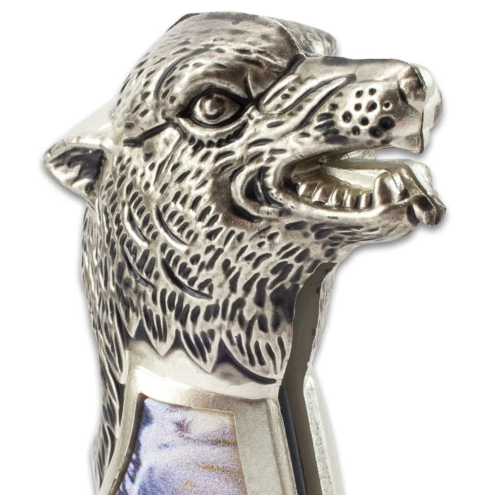 Winter wolf pocket knife with sculpted cast metal handle and winter scene artwork for collection