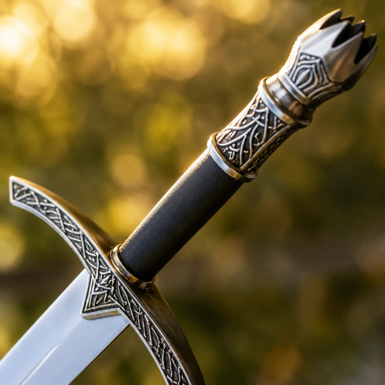 Witch-King sword prop replica held aloft in gloved hand in sunlit forest showing full silver blade and Celtic knotwork crossguard – LOTR cosplay prop